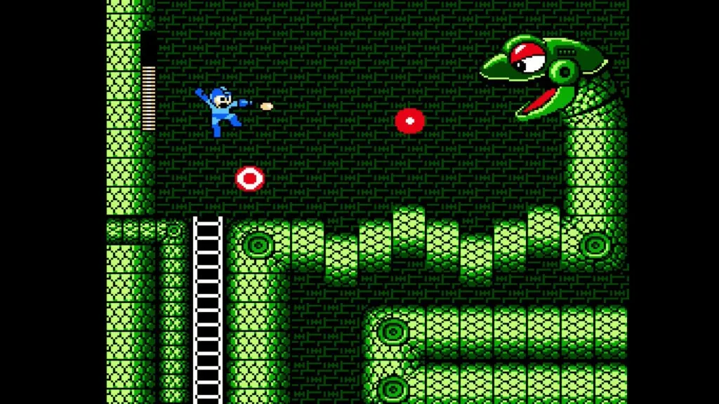 『ロックマン3』のスクリーンショット。巨大なヘビロボットの攻撃を避けながら戦っている様子。